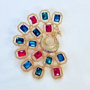 Brooch,  Peacock Brooch with Red & Green Gems on hold tone base, NIP, 2.75 x2”,